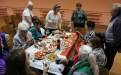 Усіх запрашаюць за святочны стол, у тым ліку Ларысу Шчыракову і мяне.